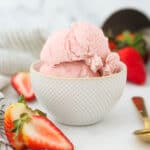A small bowl of strawberry ice cream