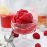 A small glass ice cream dish with raspberry sorbet