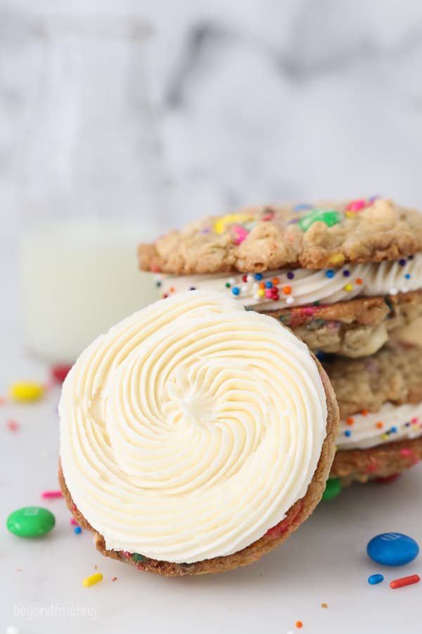 vanilla buttercream swirled on an oatmeal cookie