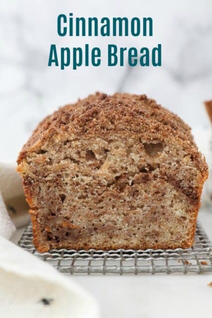 A picture with text of a cooling rack with a sliced loaf of apple bread showing the center of the bread.