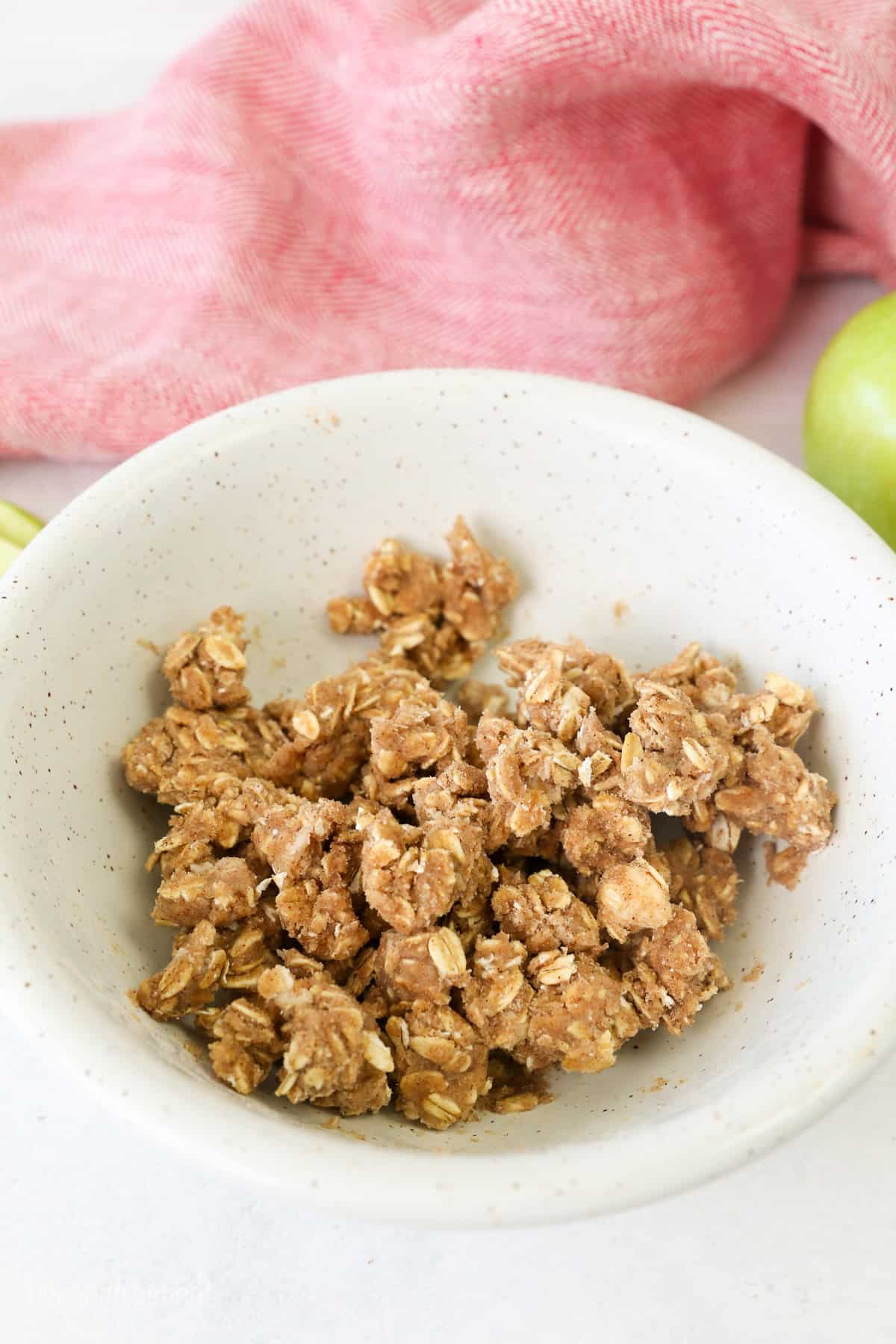 Crumble topping in a white bowl.