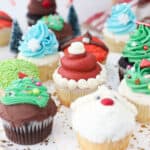 a gorgeous plate of Christmas themed cupcakes