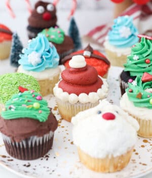 a gorgeous plate of Christmas themed cupcakes