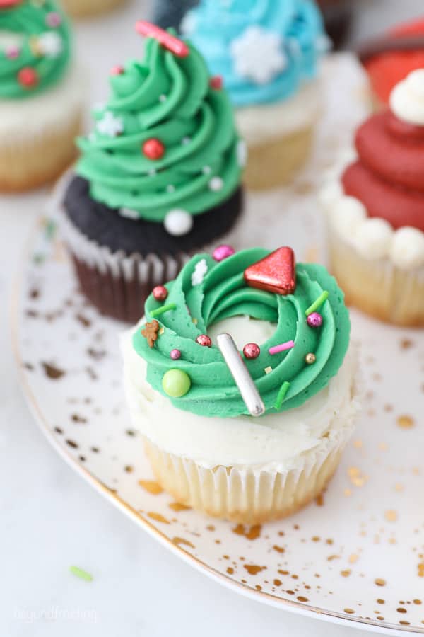 A Christmas cupcake decorated with a wreath
