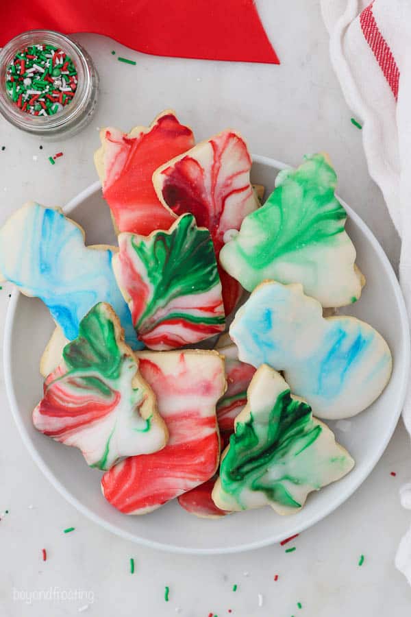 Plate of sugar cookies decorating with marbled sugar cookie icing