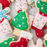 Assorted cut-out Christmas sugar cookies decorated with sugar cookie icing.