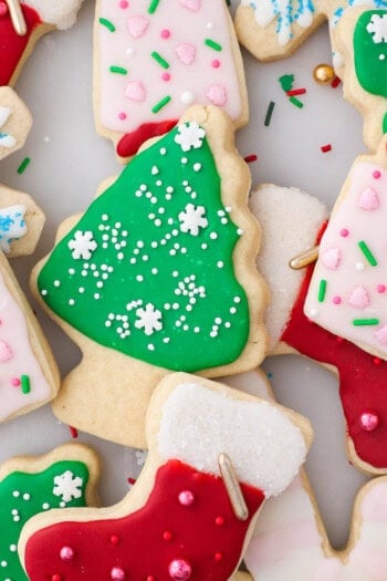 Assorted cut-out Christmas sugar cookies decorated with sugar cookie icing.