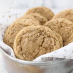 A vintage metal round pan filled with cookies