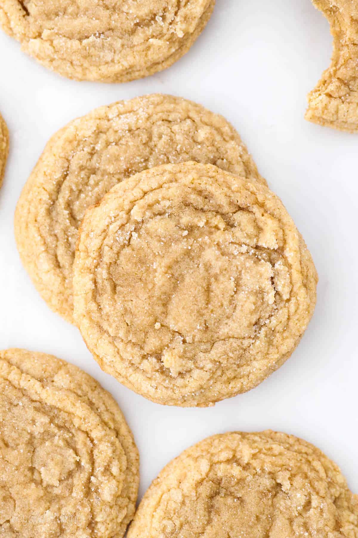 Overhead view of assorted brown sugar cookies on a marble countertop.