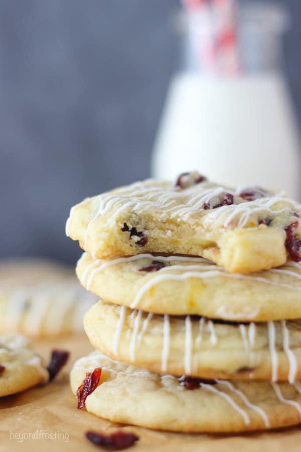 four stacked cranberry cookies, the top one has a bite missing