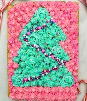 overhead shot of sugar cookie bar decorated with a buttercream Christmas tree