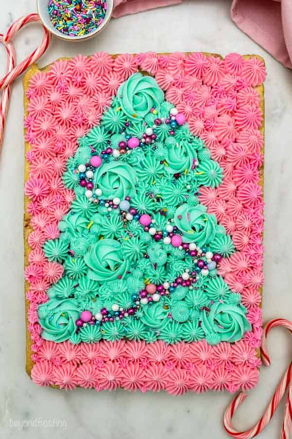 overhead shot of sugar cookie bar decorated with a buttercream Christmas tree