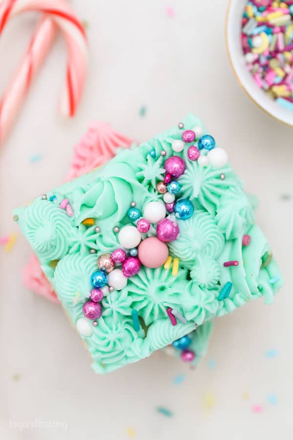 overhead shot of sliced cookie bar with frosting and sprinkles