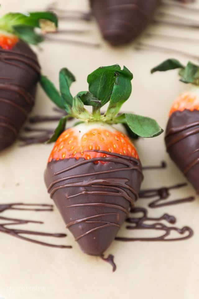 A Chocolate Covered Strawberry Decorated with a Thin Chocolate Drizzle