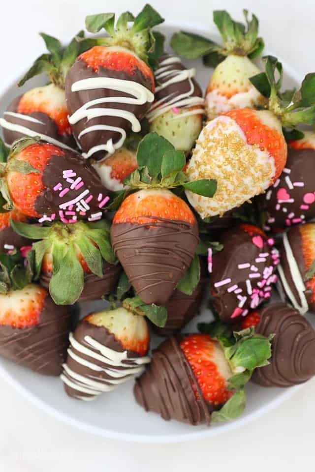A Bowl of Chocolate Strawberries with Sprinkles and White Chocolate Drizzles