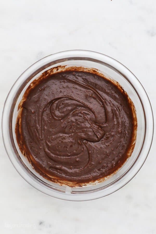 a top view of a mixing bowl of chocolate cake batter