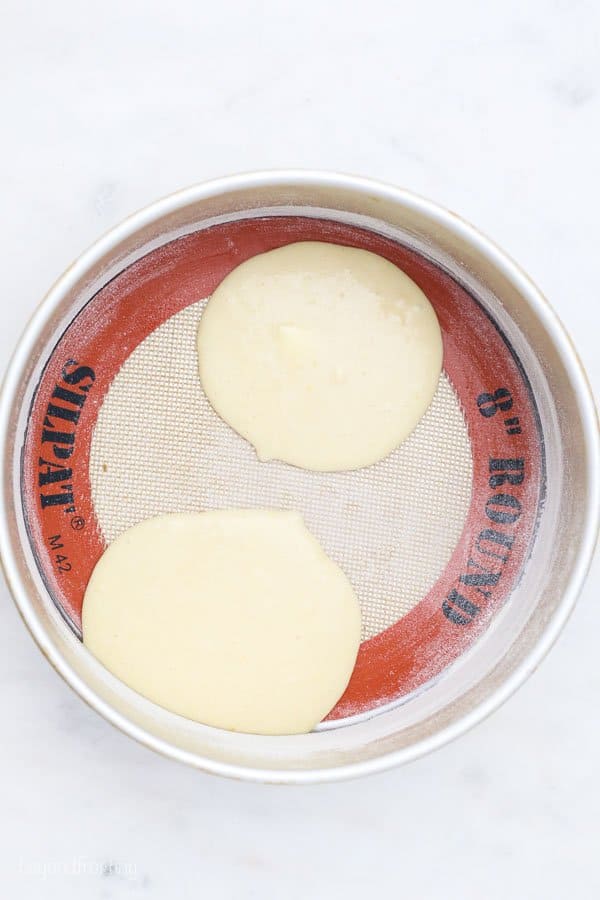 a top view of a round cake pan with batter in it