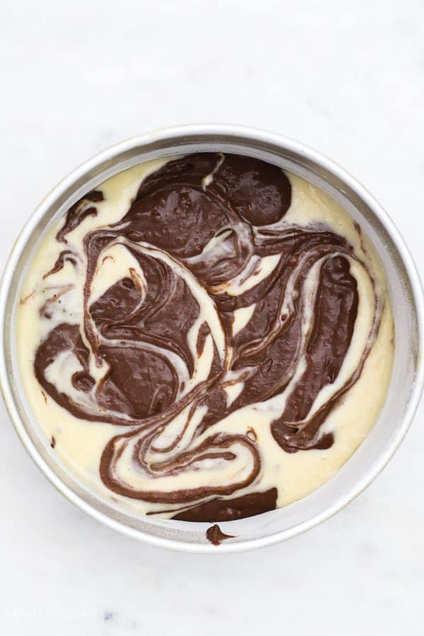 a top view of a swirled vanilla and chocolate cake batter to show a marble effect