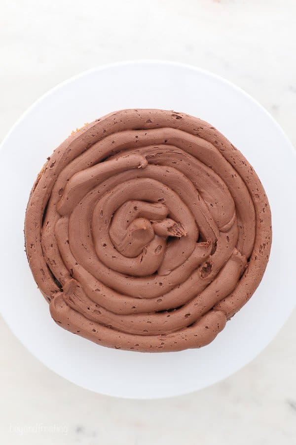 A top view of cake showing a piped buttercream