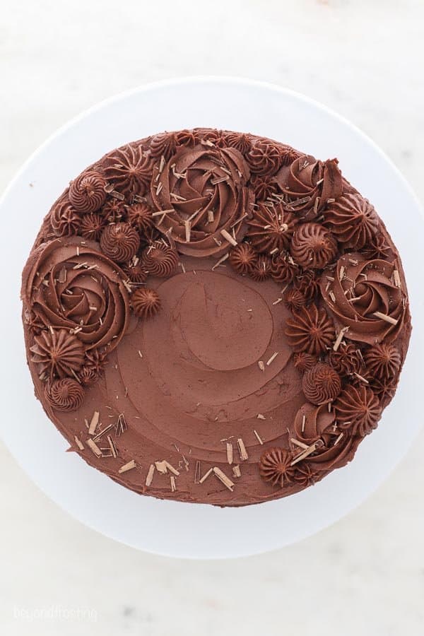 a top view of a decorated cake with chocolate frosting