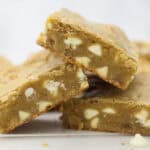 A pile of three blondies on a countertop.