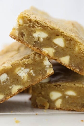 A pile of three blondies on a countertop.