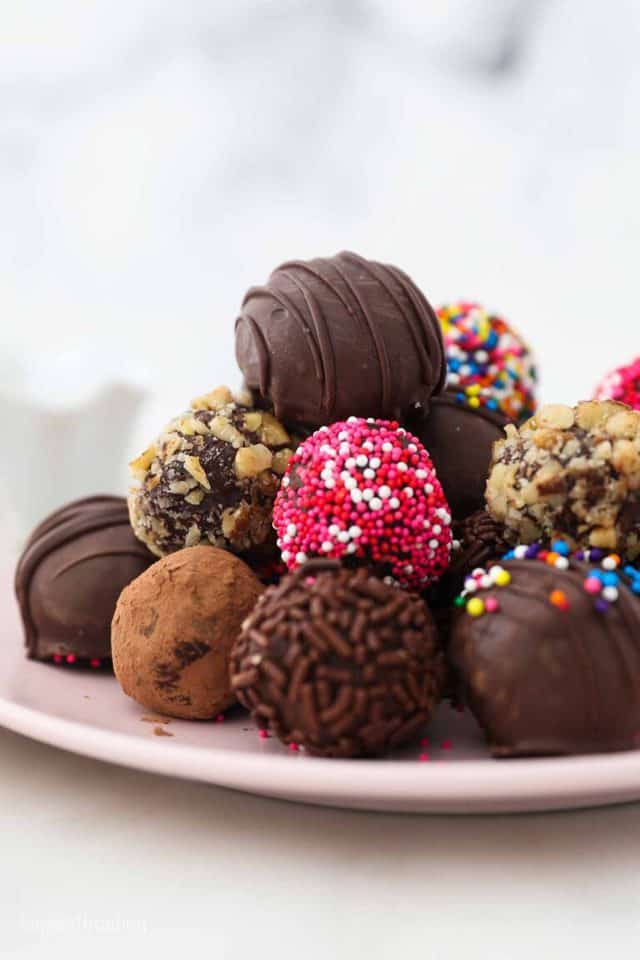 Chocolate Truffles Piled Onto a Light Pink Dessert Plate