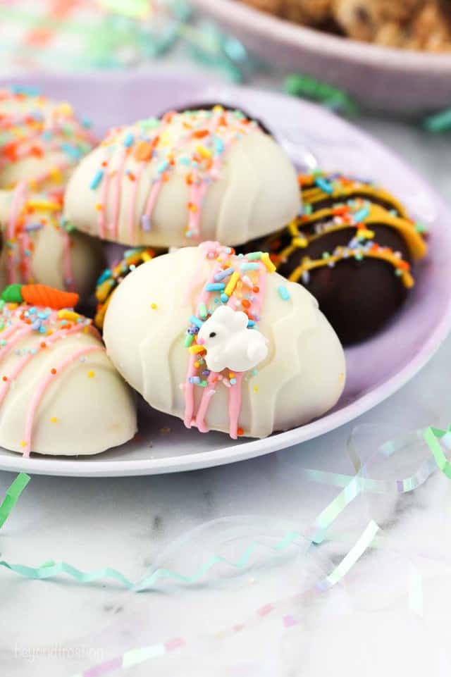 decorated chocolate easter eggs with sprinkles on a purple plate