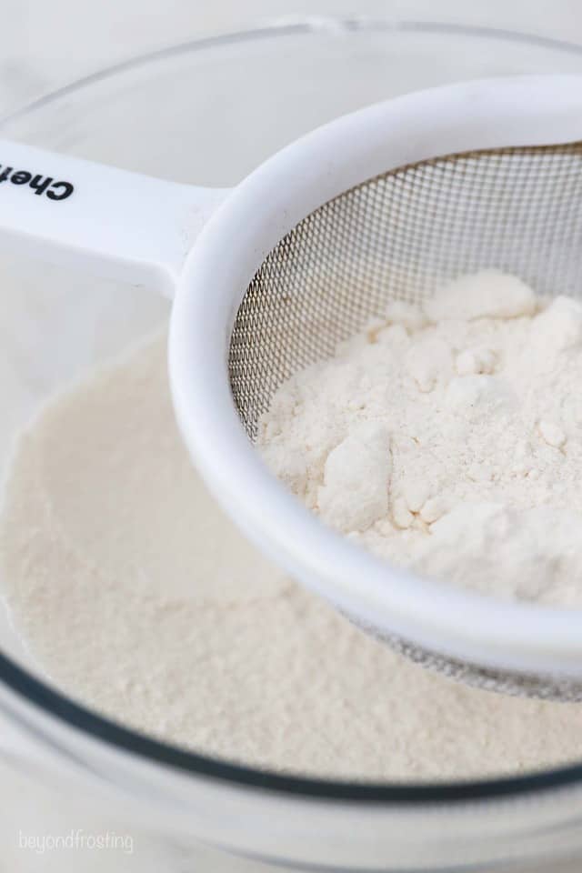 Heat Treated Flour Being Sifted Through a Mesh Sieve Into a Mixing Bowl