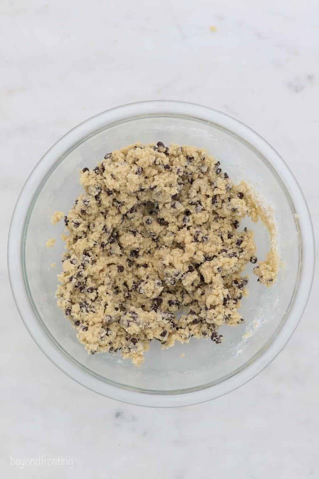 How to make edible cookie dough that's egg-free, including four delicious flavor variations. Easy to make and freezer-friendly! Edible chocolate chip cookie dough in a bowl.