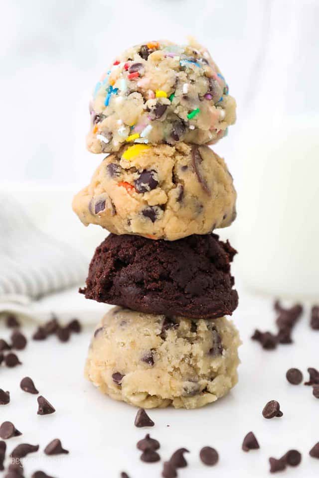 A Stack of Edible Cookie Dough in Each Flavor with Mini Chocolate Chips on the Table