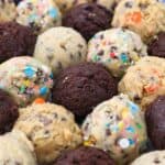 Balls of Chocolate, Chocolate Chip, Funfetti and Peanut Butter Cookie Dough on a Countertop