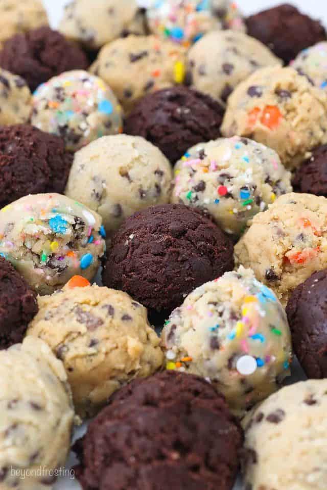 Balls of Chocolate, Chocolate Chip, Funfetti and Peanut Butter Cookie Dough on a Countertop