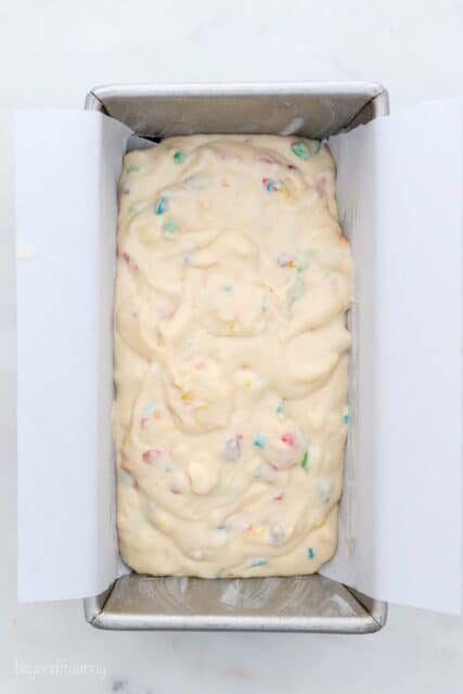 overhead view of a loaf pan filled with cake batter