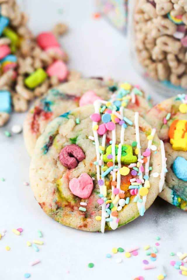 Lucky charms sugar cookies with sprinkles on a white marble background