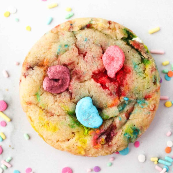 Overhead shot of Lucky charms cookie surrounded by sprinkles