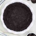 A Bird's Eye View of an Oreo Cookie Crust Pressed Into a Pie Plate