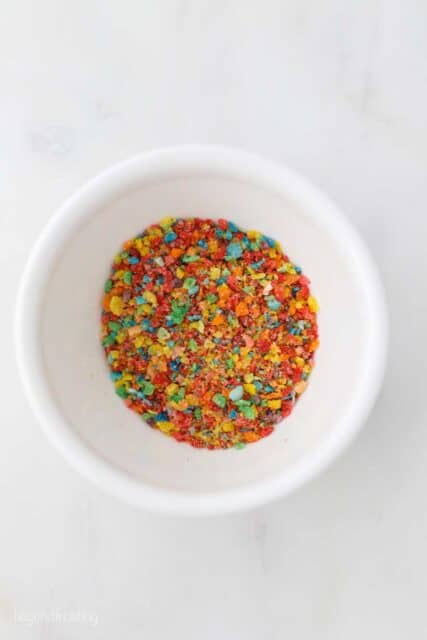 a small white bowl with fruity pebble crumbs