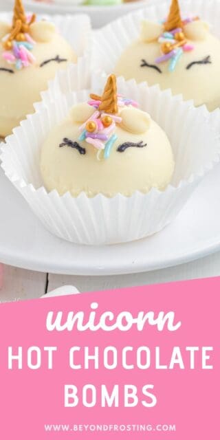 Three Unicorn hot chocolate bombs in cupcake wrappers on a white plate with a text overlay