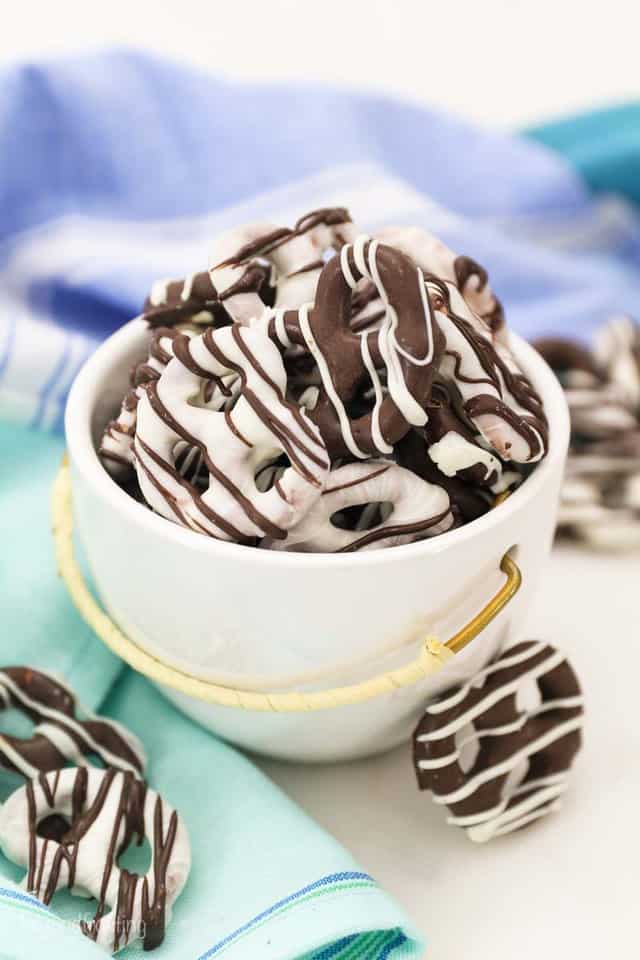 Mini chocolate covered pretzel twists with white chocolate drizzle