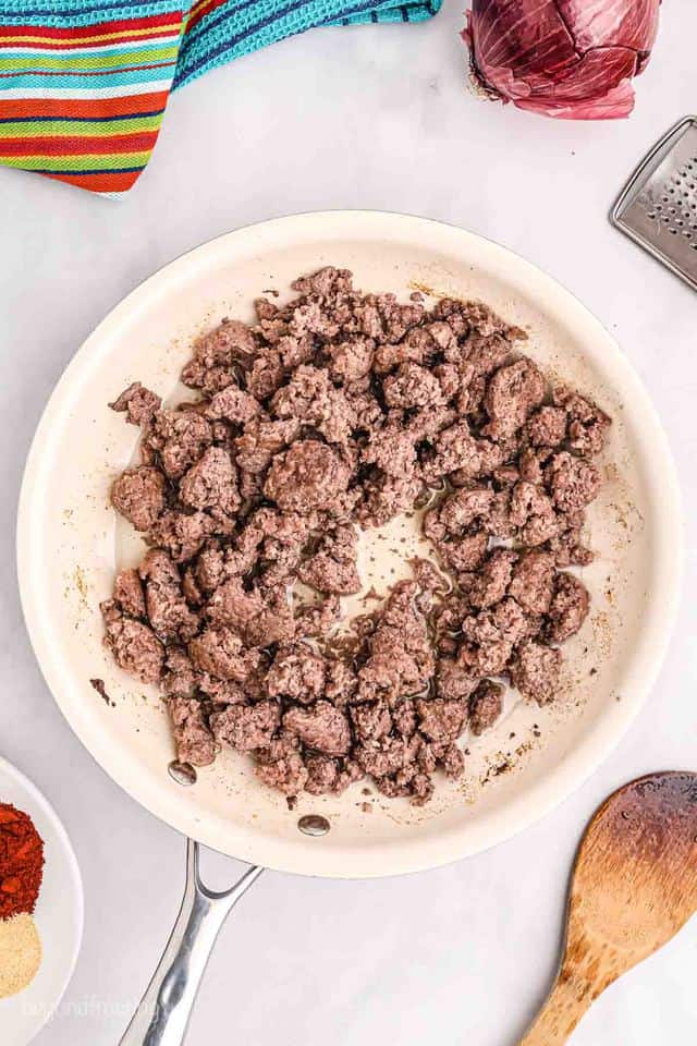 Ground beef being sauteed in a pan