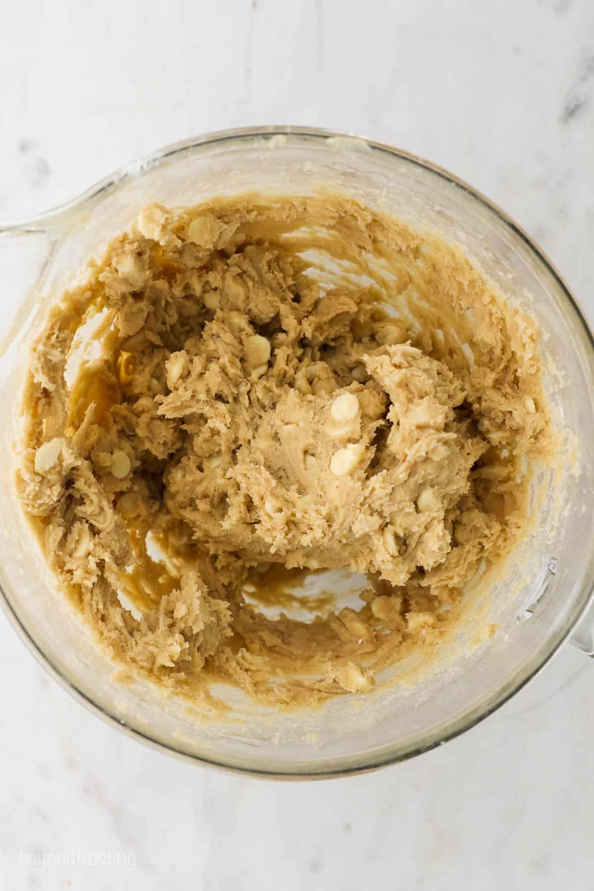 The Completed Cookie Dough in a Glass Container on a Marble Countertop