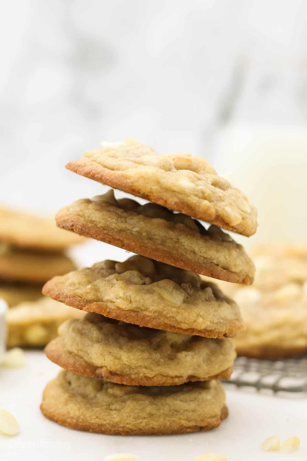 A Stack of Five White Chocolate Macadamia Cookies on a Countertop