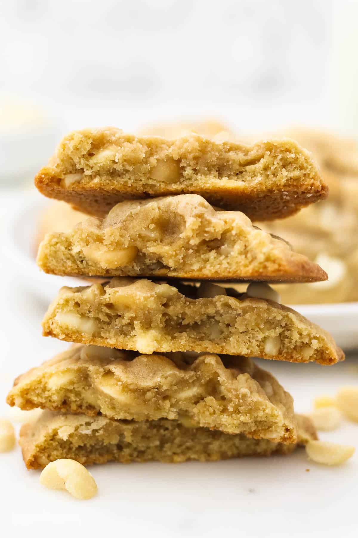 Five Chewy Macadamia Nut Cookies That Have Been Broken in Half and Stacked