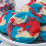 a white plate with red, white and blue tye dye cookies