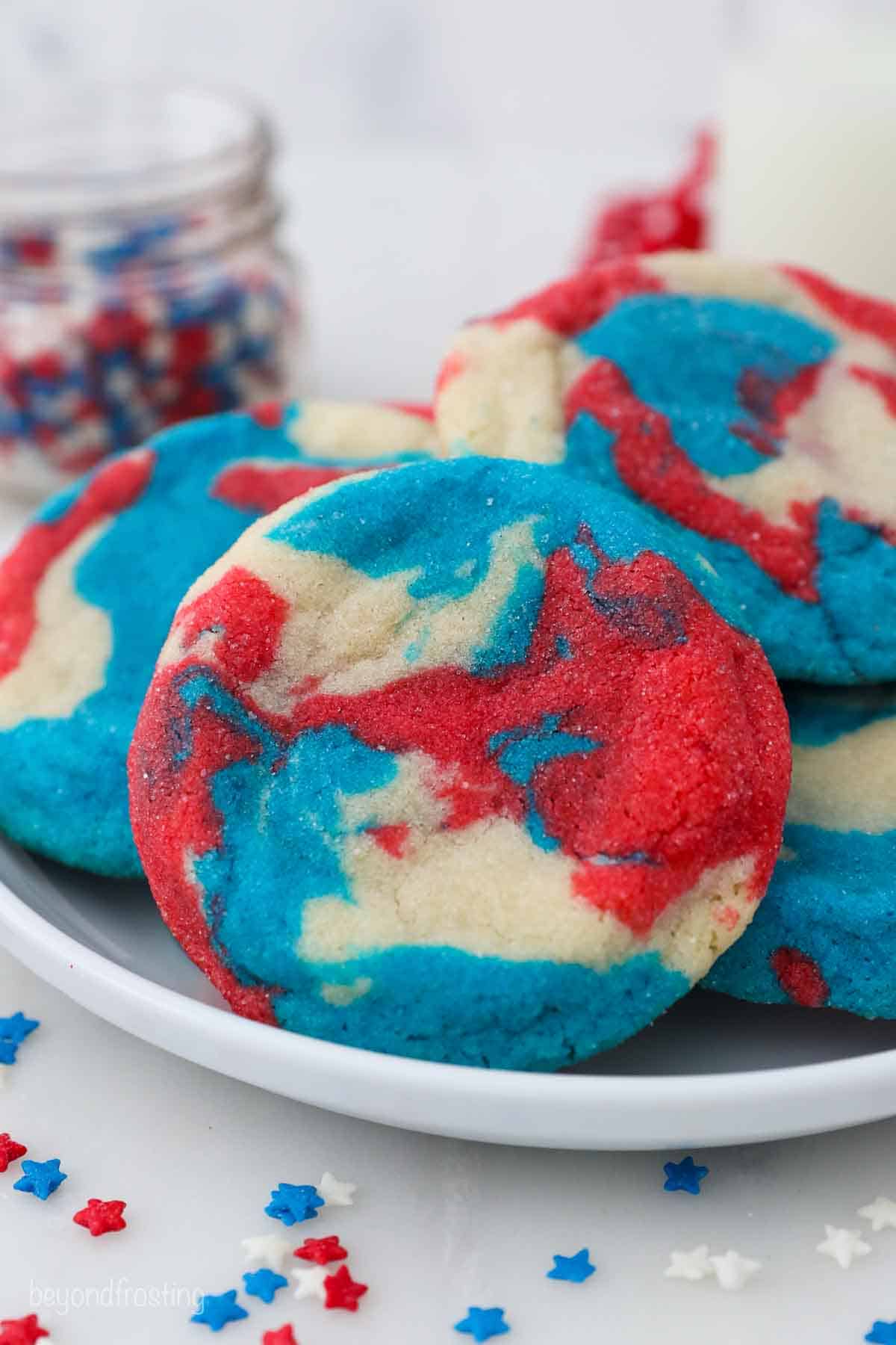 a white plate with red, white and blue tye dye cookies