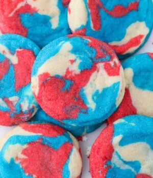 Bird's eye view of a red white and blue tye dye cookies stacked