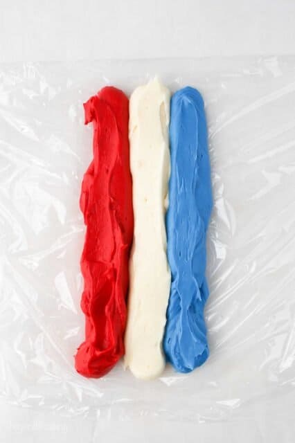 plastic wrap with three lines of frosting color red, white and blue