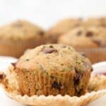 A perfectly baked moist chocolate chip zucchini muffin with the muffin wrapper removed