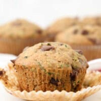 A perfectly baked moist chocolate chip zucchini muffin with the muffin wrapper removed,
